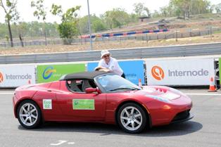 Simon Hackett with his Tesla Roadster